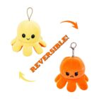 Two plush octopus toys are shown. The yellow one is smiling, and the orange one looks upset. Arrows indicate they are reversible, with the word REVERSIBLE! in the center.