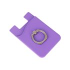 A purple card holder with a circular metal phone ring attached on the back, designed to stick to the back of a phone. The ring is centrally located on the card holder, which has a slot for storing cards.