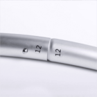 Close-up of two silver metal pipes, connected together. Both have the number 12 printed on them in black. The pipes appear to be part of a larger structure. The background is plain white.