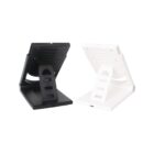 Two compact phone stands, one black and one white, with adjustable backrests. They have a minimalist design and slots for different viewing angles, positioned side by side on a white background.