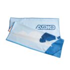A light blue towel with dark blue trim featuring the word ADIO in bold letters. The design includes abstract shapes and clouds in lighter shades, creating a dynamic and playful appearance.