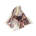A fabric square with intricate designs and multiple colors, including beige, brown, and pink, loosely folded and draped. The design includes abstract and possibly decorative elements.