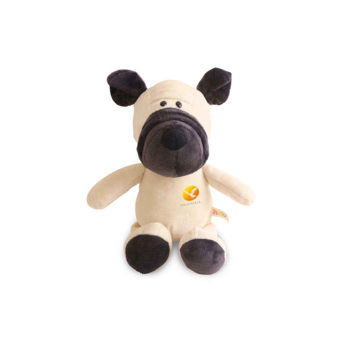 A beige and brown plush toy dog with floppy ears and a round muzzle, seated upright. It features a small emblem with an orange and yellow design on its front. The dog has stitched eyes and mouth details.