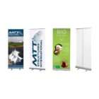 Four vertical banner stands. The first shows a large tent and the MTT International logo. The second features MTT Structures International with a geometric design. The third is a green Bio basse-cour banner with food images. The fourth is blank.