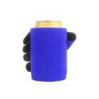 A gloved hand is holding a can wrapped in a bright blue can cooler. The can has a yellow top and is labeled Crystal Spring Peach Tea. The glove is black, contrasting with the vibrant blue of the cooler.
