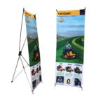 Two vertical banner stands display imagery and information about Cub Cadet lawn mowers. The banners show a person mowing a lawn with different mower models and features highlighted.