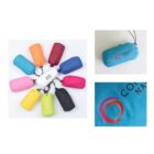 A circle of colorful, compact drawstring bags, including blue, orange, red, pink, yellow, green, black, and white, surrounds a white bag labeled Your Logo. Side images show a blue bag with the Company Name logo and a close-up of the logo.