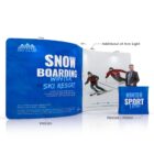 Trade show display featuring a Snowboarding Winter Ski Resort banner and images of skiers. Includes a light fixture on top and a man in a suit standing, with a bag labeled Winter Sport Fun near the setup.