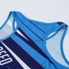 Close-up of a sleeveless athletic tank top with blue and navy stripes. The text SPEED LINES is printed in white on the front. The top is displayed on a light background.