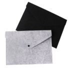 Two felt envelope folders, one black and one gray, overlap each other. Both have a flap closure with a button in the center. They are positioned against a plain white background.