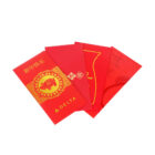 A set of four red envelopes with gold designs and Chinese characters. The front envelope features a decorative ox and the text 新年快乐 alongside an airline logo. The others have various patterns and subtle designs.