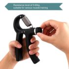 A hand is adjusting a black hand grip strengthener with a silver coil and a resistance knob. Text above reads, Resistance level of 5-60kg, suitable for various muscle training.