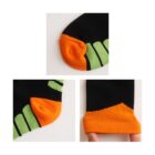 Three close-up images of a sock. One shows the orange toe area with black above. Another shows the orange heel with green stripes on black. The third image shows the orange cuff with a hand lightly stretching it.