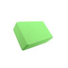 A green yoga block with a rectangular shape and beveled edges, set against a plain white background.