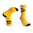 Yellow socks with black toe and heel areas, featuring a repeated pattern of white eyeglasses. One sock displays a masked eye design near the cuff.