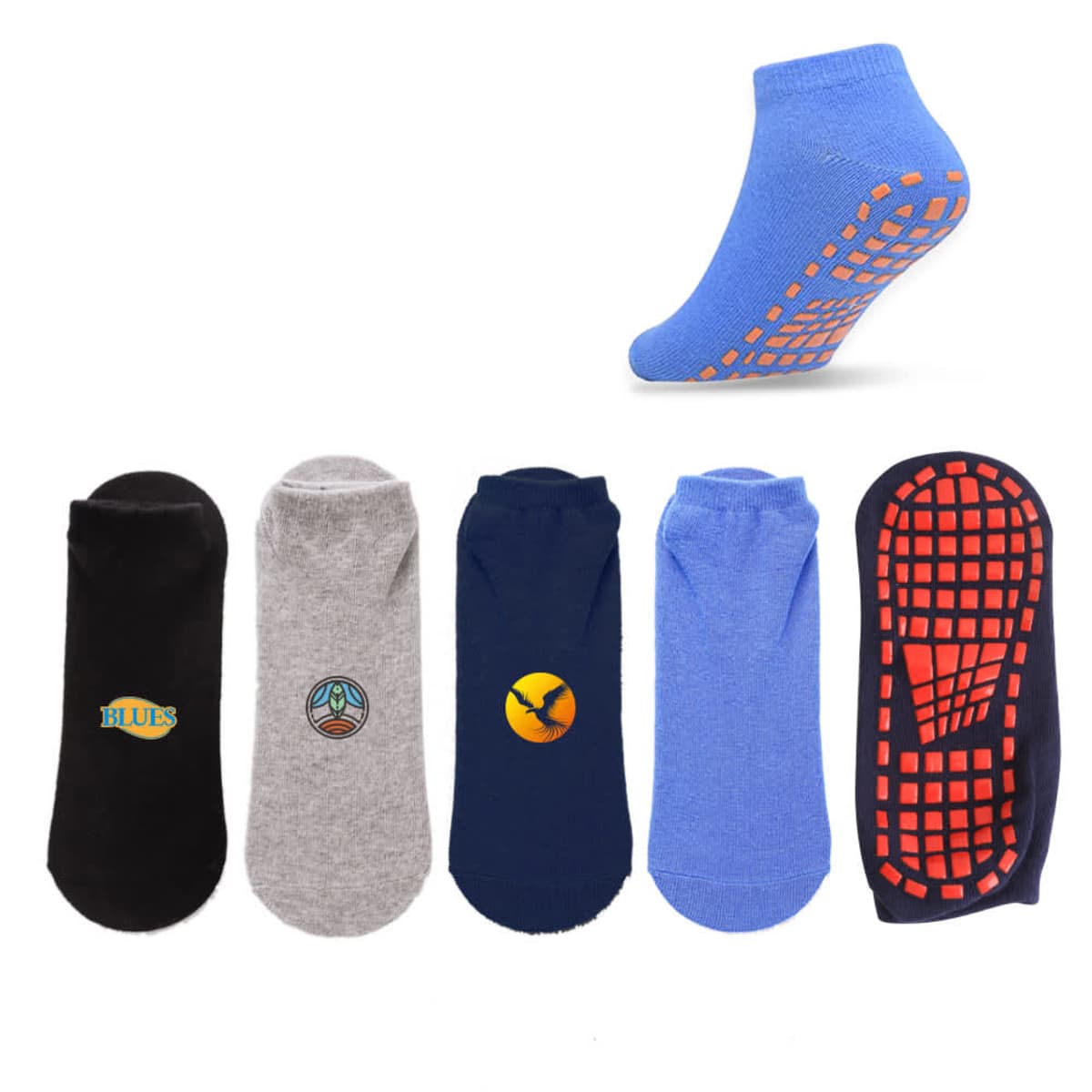 Five pairs of ankle socks in various colors: black with a logo, gray with a peace sign, dark blue with a yellow circle, blue with orange grip, and dark blue with orange grip pattern on the sole. One blue sock is showcased with grip side up.