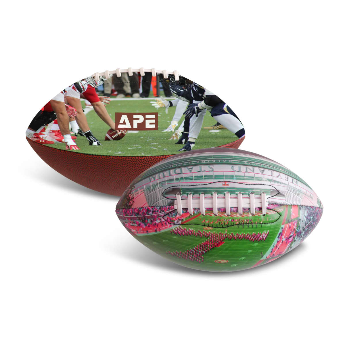 Two footballs featuring printed images: one shows a game in progress with players on a field; the other depicts a stadium with a marching band performance. The APE logo is visible on the first football. Both have white laces on a textured surface.