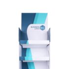 White and teal cardboard display stand with three shelves and a Business Logo on the header. The stand features a modern, geometric design with shades of blue and teal, suitable for showcasing products in a retail setting.