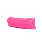 A bright pink inflatable lounger is shown against a plain white background. The lounger is puffed up, appears comfortable, and is designed for outdoor use, such as at the beach or in a park.