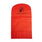 A red garment bag with a carrying handle at the top. It has a black logo and the text COMPANY YOUR TAGLINE printed on the front. The bag is laid flat and appears to be made of a lightweight material.