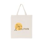 A beige tote bag displaying a simple line drawing of a dolphin leaping in front of an orange circle. The word DOLPHIN is written beneath the dolphin illustration. The bag has two handles on top.