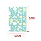 Illustration of a cloth with a kitchen-themed pattern featuring utensils, cups, and food items. The cloth measures 50cm in width and 70cm in height. Background color is teal with cream-colored icons.
