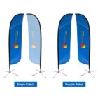 Two feather banners with a blue design on cross bases. The one on the left is labeled Single Sided, and the one on the right is labeled Double Sided. Both display a colorful logo with the text ELECTRA DISPLAYS.
