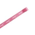 A pink ribbon with the word Serge repeated along its length in white text, angled diagonally on a plain white background.