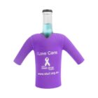 A bottle wearing a purple koozie shaped like a shirt with the text I Love Cans, a breast cancer foundation logo, and a website URL. The koozie is designed to support breast cancer awareness.