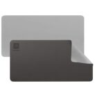 A rectangular, dual-sided mouse pad with one side black and the other gray. It features a small geometric logo and the words Lorem Ipsum on the black side. The corner is lifted to show the gray side underneath.
