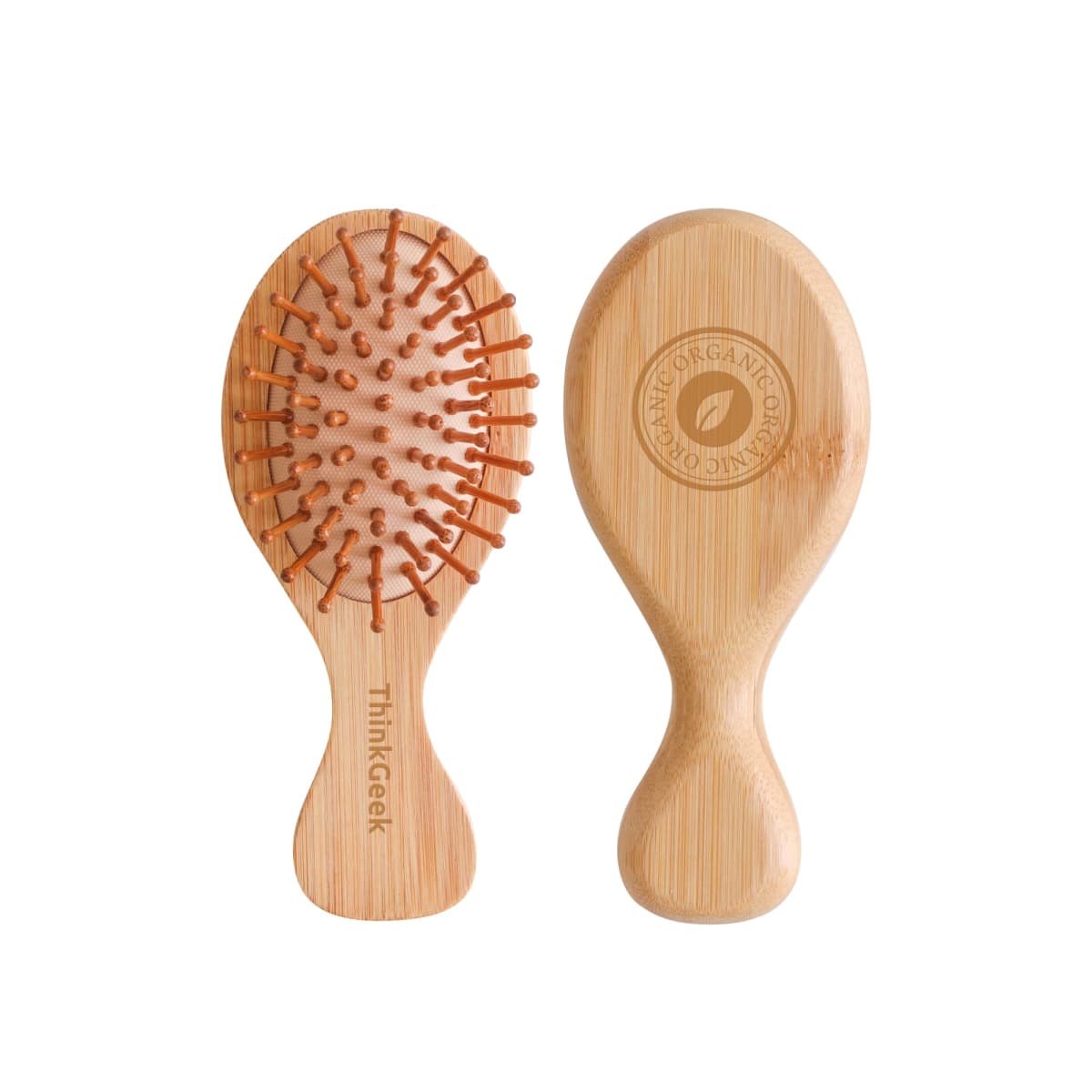Two wooden hairbrushes with light brown handles. The front brush has soft bristles with round, orange tips. The back brush displays a logo with a leaf design and the words ORGANIC COMB. The brush on the left has Thinkgeek written on the handle.