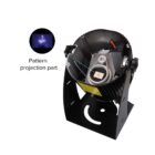 A black stage light with an open casing reveals internal components, including a projection lens and wiring. A small inset shows the pattern projection part emitting a blue, star-like design. Labels highlight specific parts inside the light.