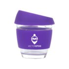 Reusable glass cup with purple silicone lid and sleeve, featuring a logo of a person reading a book within a heart shape. The text Vector EPS 10 is printed below the logo.