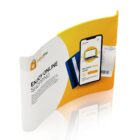 Curved promotional display showing a smartphone with an online shopping app. The screen displays a New Stylish Laptop with a price of $999.99. The background is yellow and white with the text Enjoy Online Shopping.