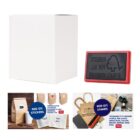 A blank white box, a red rubber stamp with text, and a brochure showcasing customizable stickers and stamps. The brochure images include kraft paper bags with blue stickers and a variety of stamp designs.