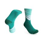 Two teal and white sport socks are shown. One sock is upright, and the other is angled to display its sole. Both have a chevron pattern near the ankle and dark green accents on the toe and heel.