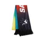 A multicolored scarf with red, green, yellow, and blue gradients, featuring a shark logo and black fringe at the ends. The partial text SAN is visible near the top.