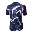 Back view of a cycling jersey featuring an abstract design with geometric shapes in blue, white, red, and purple. The short-sleeved jersey has a fitted style with text running vertically on the side.