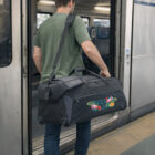 Man boards train with Forms Corporate Travel Duffle Bag, ready for his next adventure.