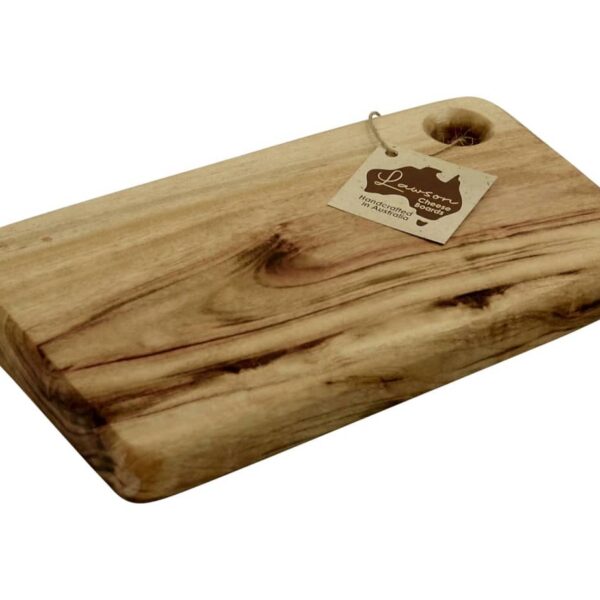 A rectangular wooden chopping board with a smooth, natural grain finish and rounded edges. It has a hole at one corner with a small tag attached, offering a simple and rustic kitchen accessory.