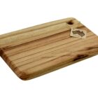 A rectangular wooden cutting board with a smooth finish and natural grain patterns. It has a small hole near one corner for hanging and a tag attached.