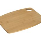 A rectangular bamboo cutting board with rounded edges and a cutout handle in one corner, isolated on a white background.
