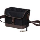 A black and brown canvas shoulder bag with a flap closure, adjustable strap, and a metal buckle detail on the front.