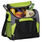 A green and black insulated cooler bag with an open top, filled with various items including wine, a soda can, grapes, an apple, a green glass bottle, and a snack bag labeled Coffee Kettle chips. The bag has handles and a front pocket.