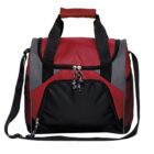 A red and black duffel bag with a shoulder strap and handles. The bag features a front zippered pocket and a main compartment with double zippers. It is designed with contrasting panels in gray and has a padded handle for comfort.