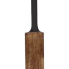 A cricket bat with a black handle and a wooden blade, featuring engraved text. The blade appears slightly worn, indicating use. The background is plain white.