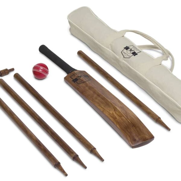 A cricket set including a wooden bat, four stumps, two bails, a red leather ball, and a white carrying bag with black logos is neatly arranged on a white background.