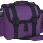 A purple and black insulated bag with adjustable shoulder strap. It features a zippered main compartment, two side pockets, and a front buckle closure. One side pocket holds a gray bottle. The bag has a textured handle on top.
