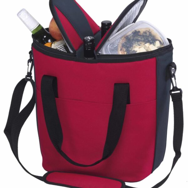 A red and black insulated cooler bag with a shoulder strap, filled with items including a bottle of wine, a juice bottle, a pear, and a transparent container of food. The bag has a front pocket and zipped compartments.