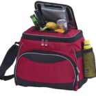 A red and black insulated cooler bag with a shoulder strap, partially open to reveal a green bottle, a banana, and a can inside. A yellow bottle is in the side mesh pocket. The coolers lid is slightly open.